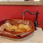 Unique wooden basin with black & gold tap