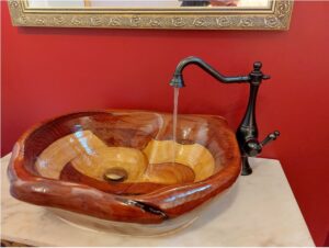 Unique wooden basin with black & gold tap